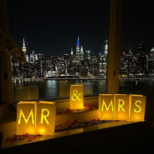 “MR & MRS” light up letters with Tealight Candles and Rose petals