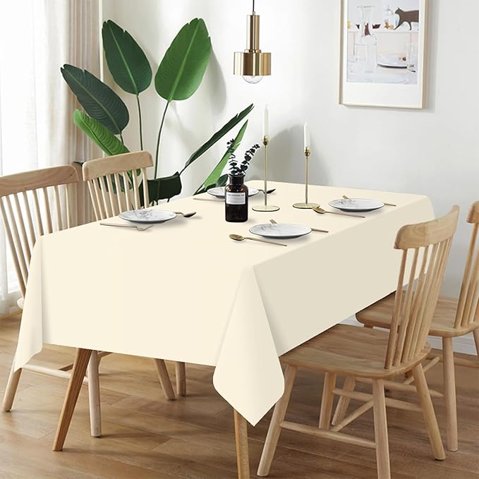 QIKSION Ivory Plastic Table Cloth Disposable 12 Pack, 54 x 108 Inch