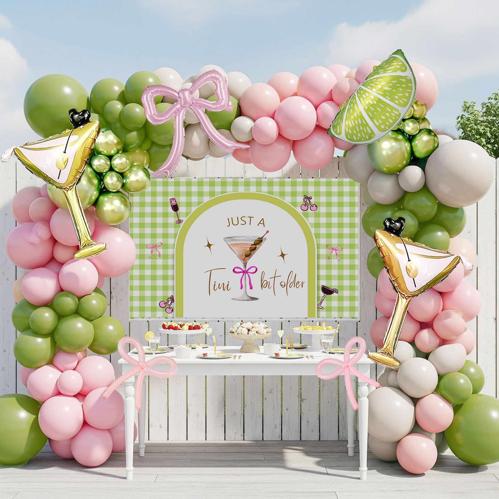 A Tini Bit Older balloon garland arch kit with Pink oilve green